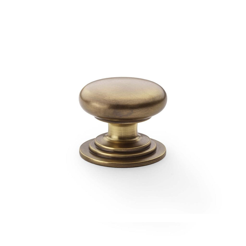 Round Brass Cupboard Knob on Stepped Rose Antique brass