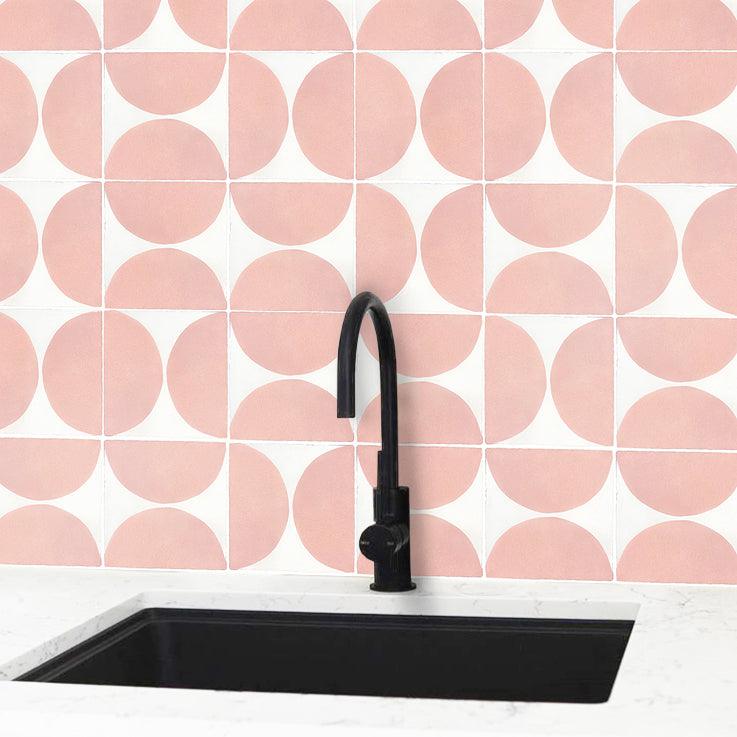 Pink hand painted tiles with stylish black facet and basin