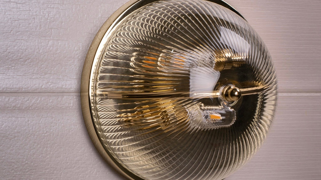 Bathroom wall light with etched glass and a polished brass finish 