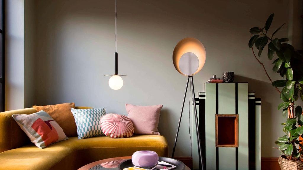 Globe pendant light in maximalist living room