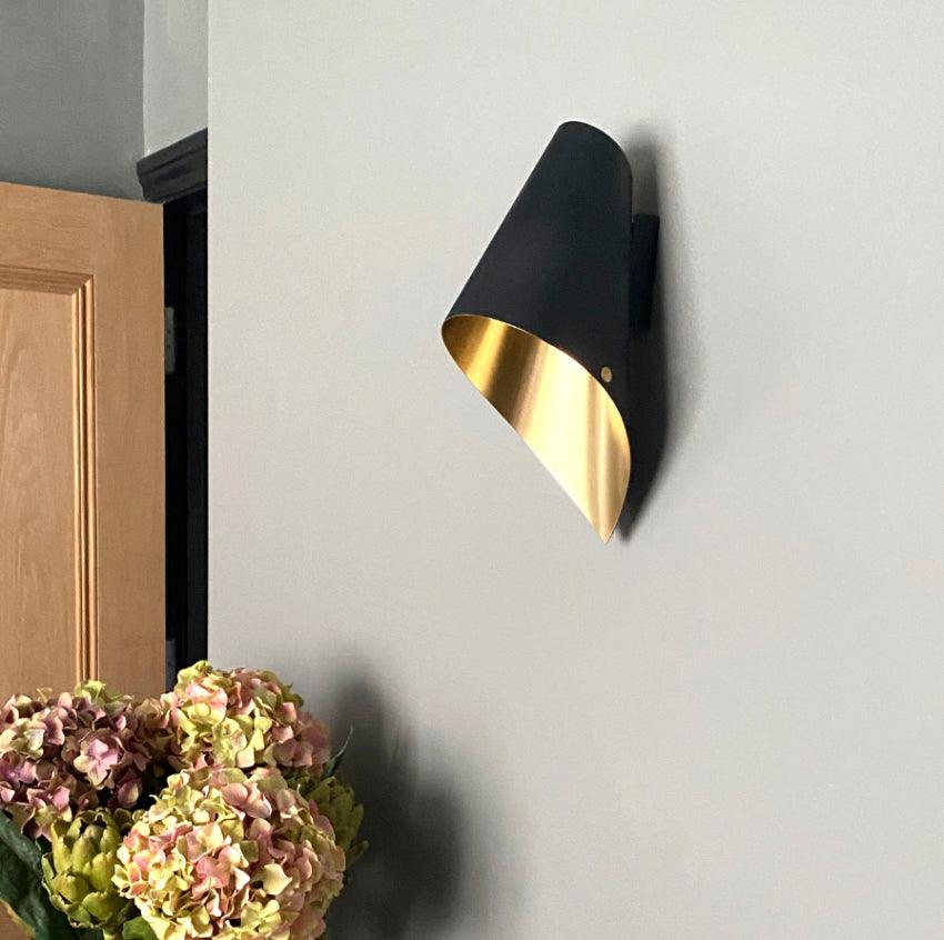 Brass Asymmetric Wall Light In stylish home 