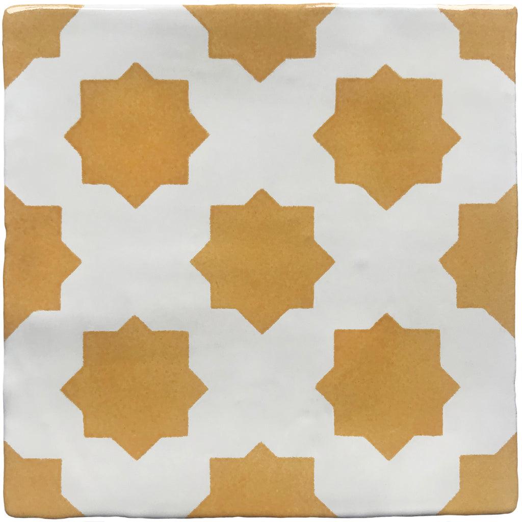 Yellow hand painted tiles with a star design 